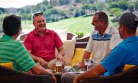 golfers relaxing on the terrance bar of the La Cala clubhouse